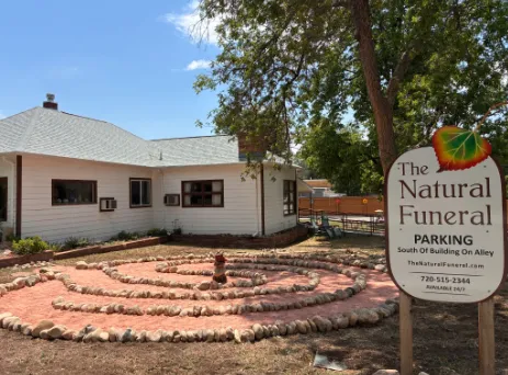 The stone walking labyrinth outside The Natural Funeral in Lafayette, laid in river rock on open ground beside the funeral home